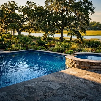 A free-form shotcrete pool cut to the shape of a marsh-front lot