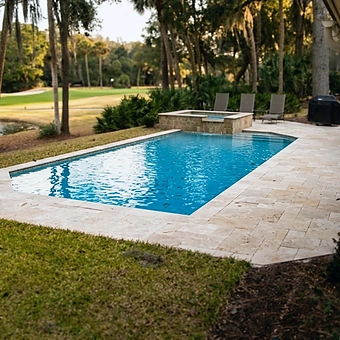 A fiberglass shell newly set into a level lawn