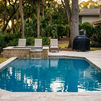 A pergola, spa and pool terrace looking out to a Hilton Head lagoon