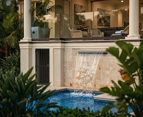 20 Knightsbridge, Hilton Head — a wide sheet of water falling from the house wall